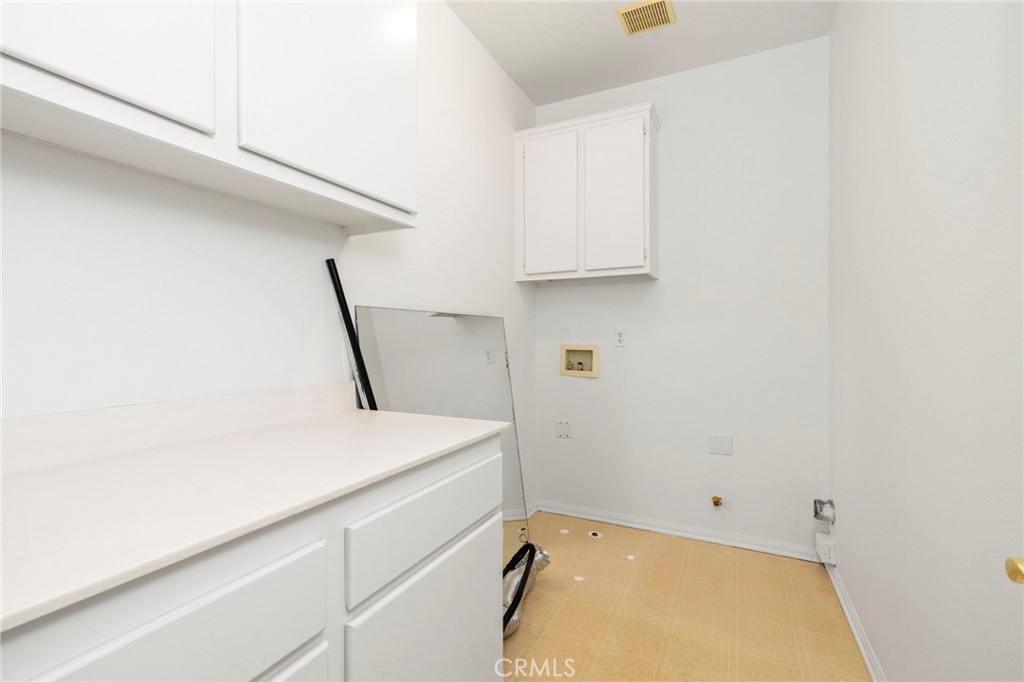 4 Toribeth Street, Unit 8 Ladera Ranch, CA 92694 - Photo 14 of 26 Laundry and linen area with ample storage