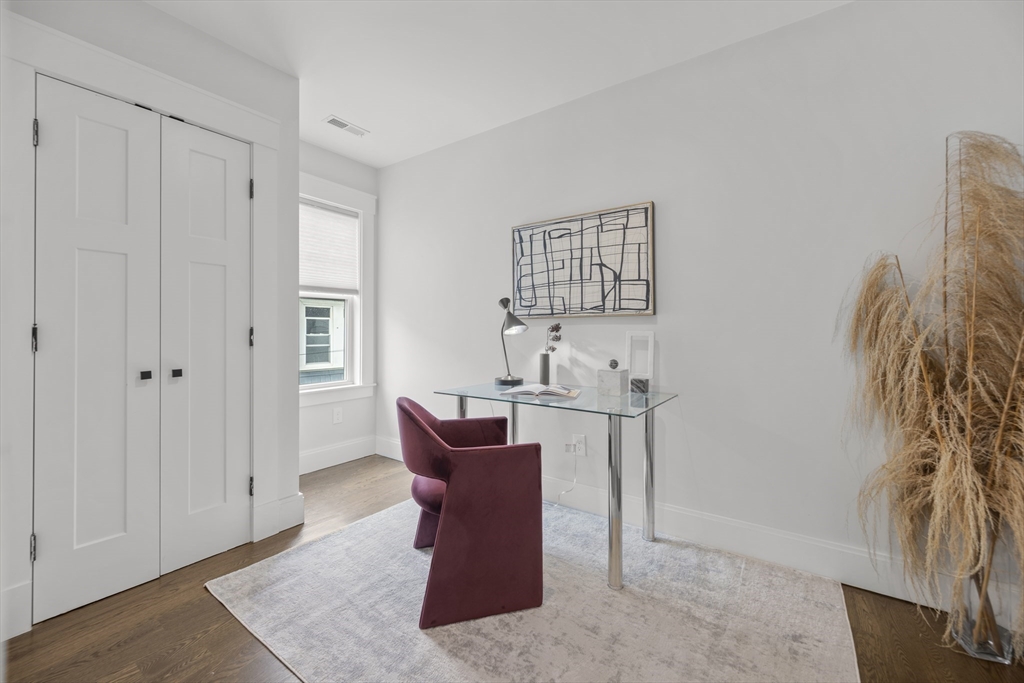 72 Governor Winthrop Road, Unit 2 Somerville, MA 02145 - Photo 20 of 27 a view of a livingroom with furniture and window