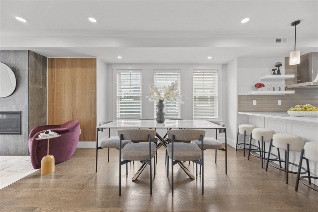 72 Governor Winthrop Road, Unit 2 Somerville, MA 02145 - Photo 5 of 27 a dining room with furniture and wooden floor