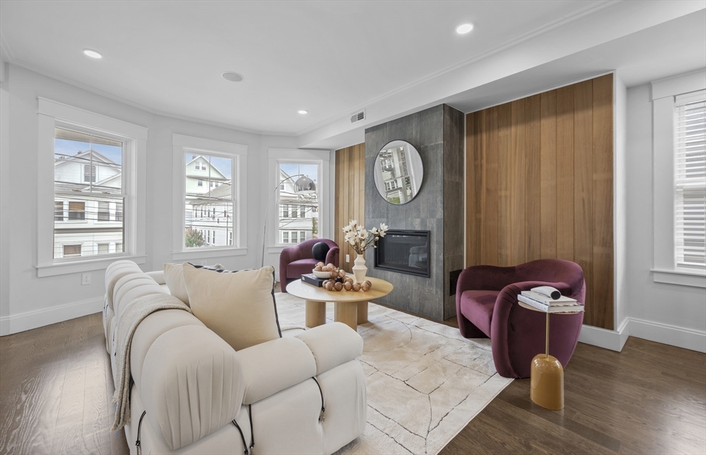 72 Governor Winthrop Road, Unit 2 Somerville, MA 02145 - Photo 6 of 27 a living room with furniture and wooden floor