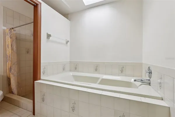 a bathroom with a bathtub and a sink