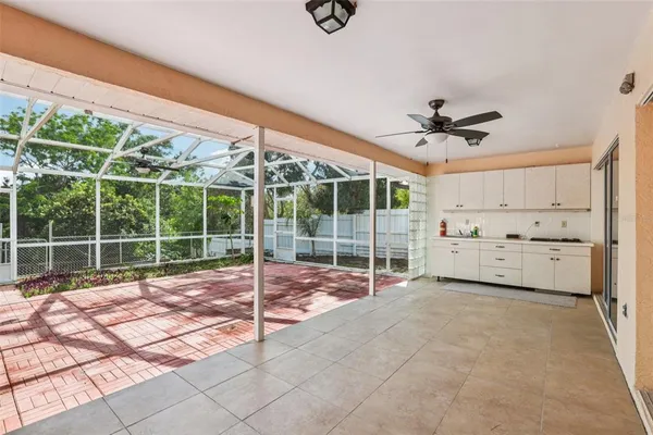 a view of a room with wooden floor and windows