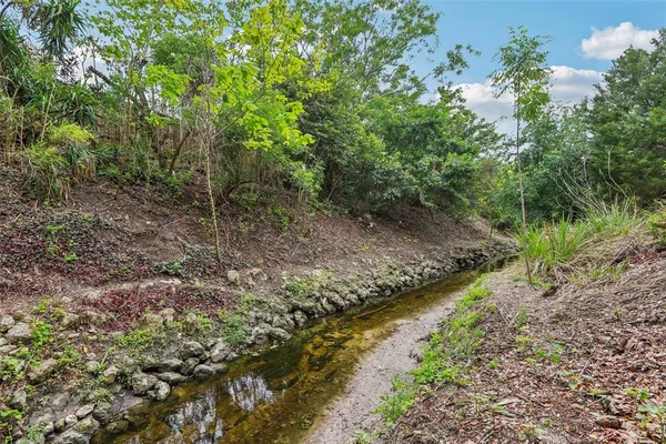 a view of a balcony with potted plants