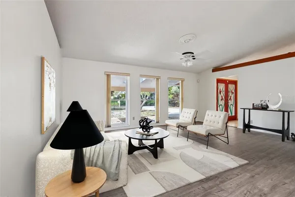 a living room with furniture and a window