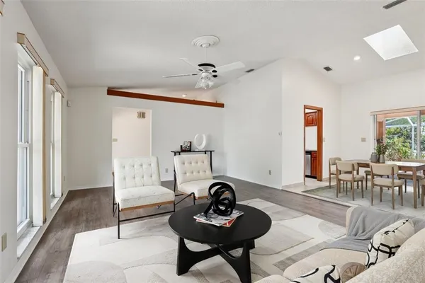 a living room with furniture and a window