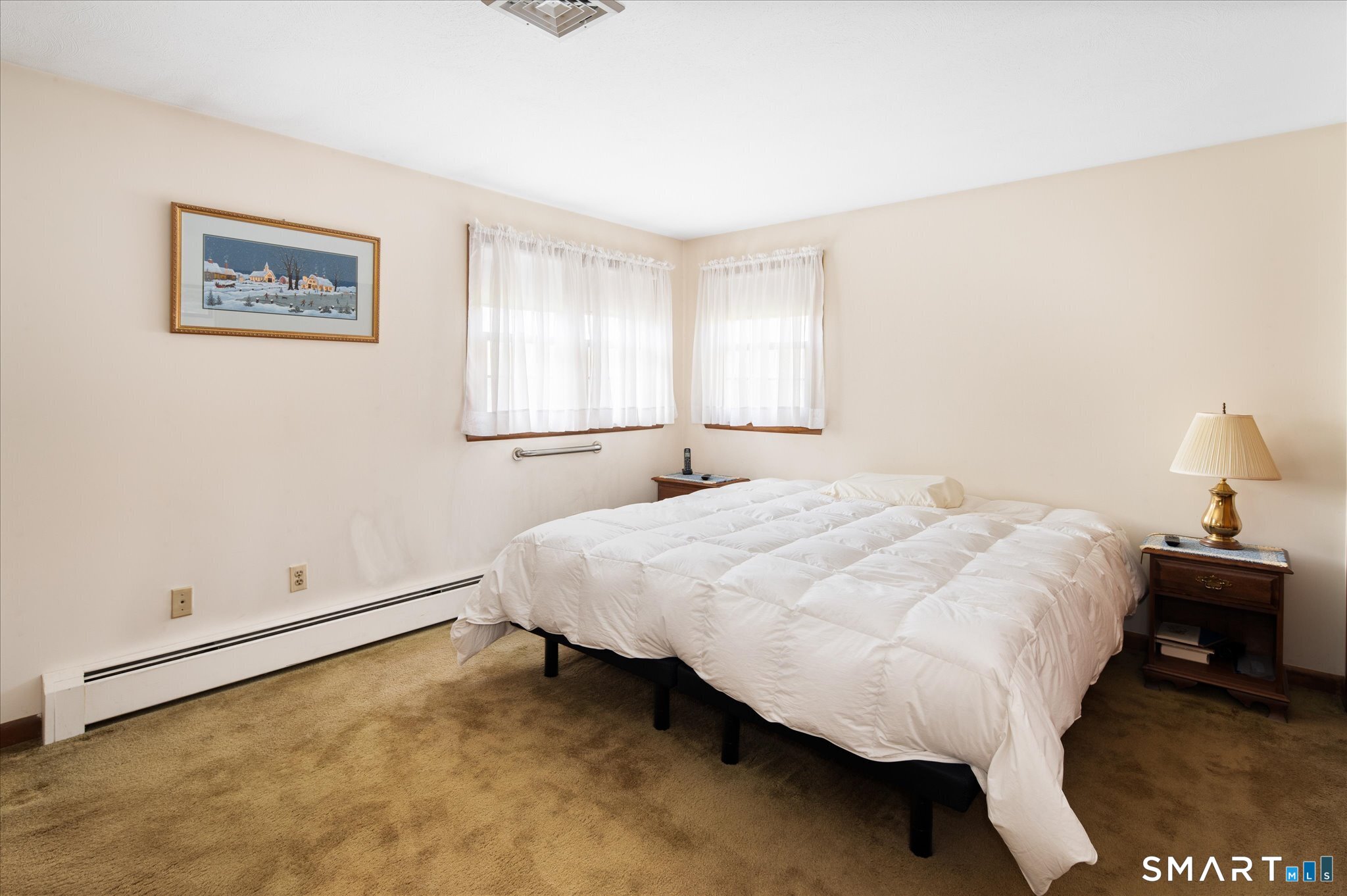 100 Bette Circle Vernon, CT 06066 - Photo 20 of 32 a bedroom with a bed and painting on the wall