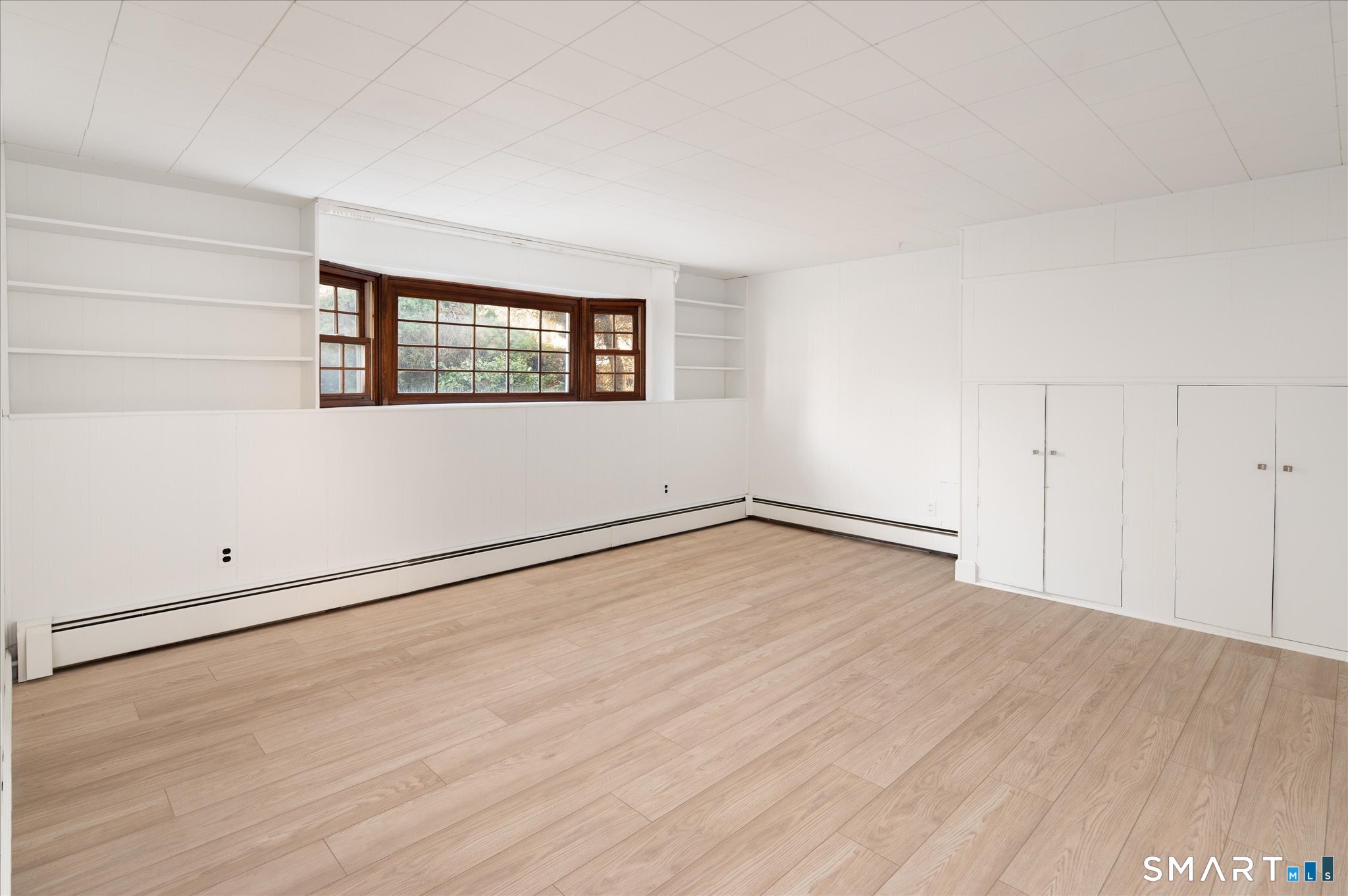 100 Bette Circle Vernon, CT 06066 - Photo 29 of 32 an empty room with wooden floor and windows