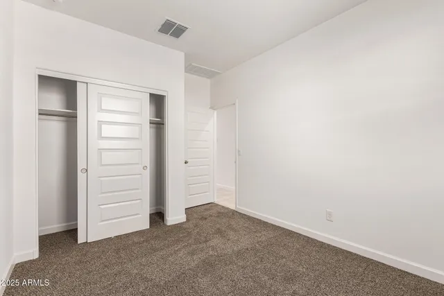 a view of an empty walk in closet