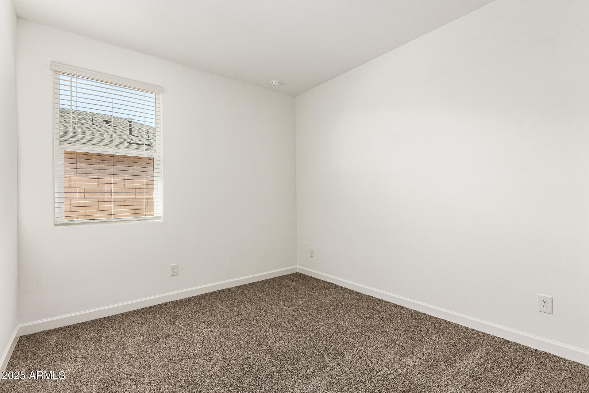 5507 East Mearn Road San Tan Valley, AZ 85140 - Photo 18 of 30 an empty room with a window