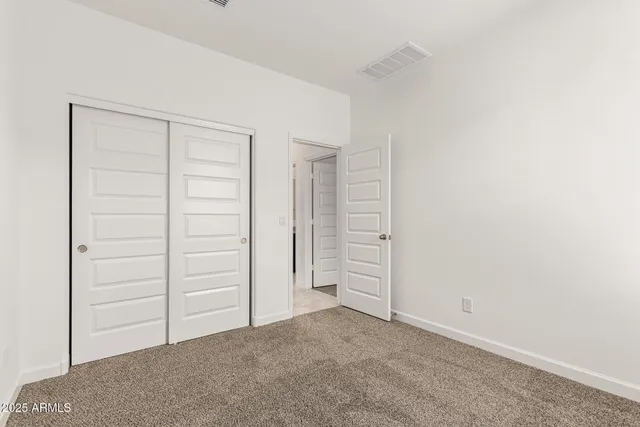 an empty room with closet
