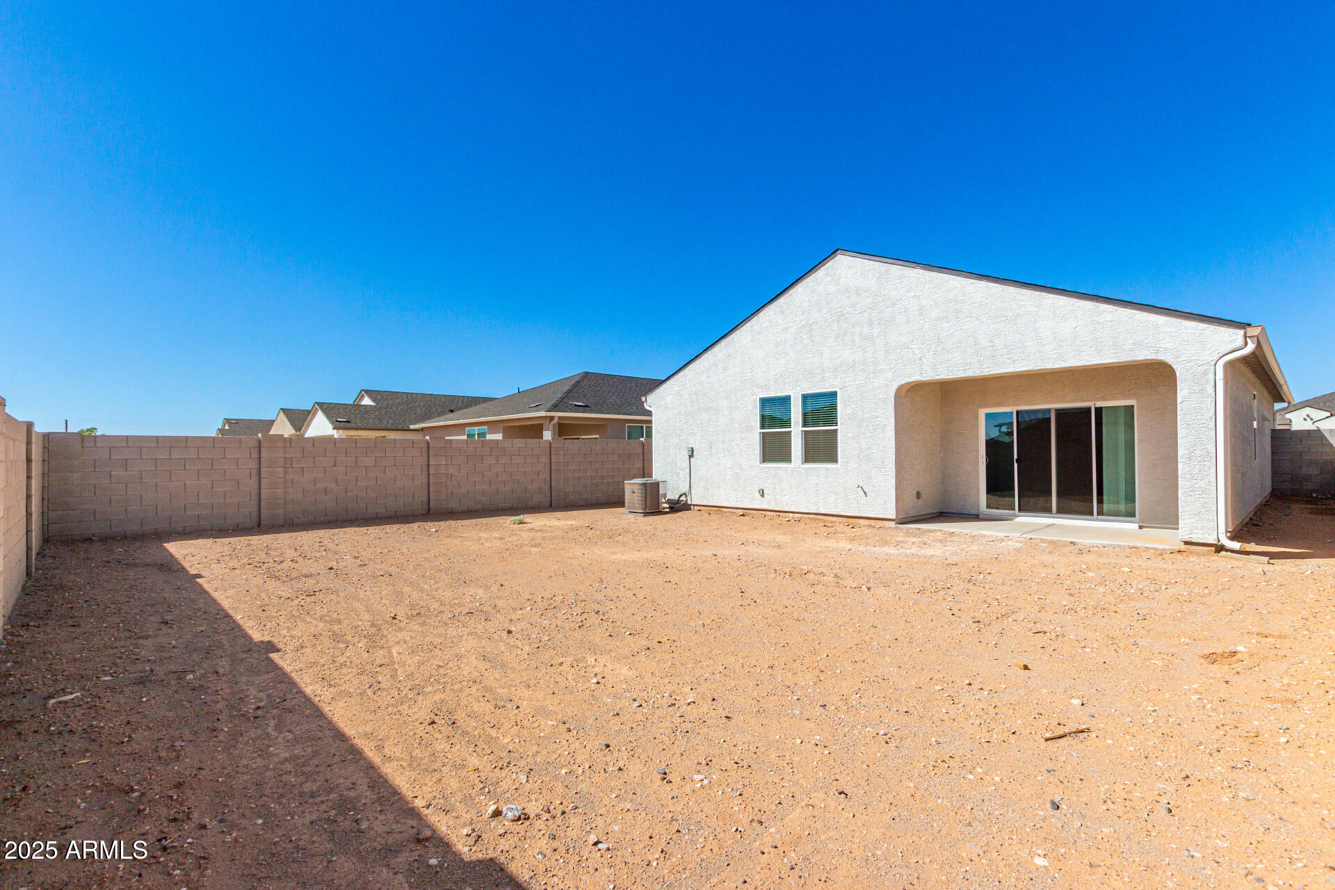 5507 East Mearn Road San Tan Valley, AZ 85140 - Photo 26 of 30 a backyard of a house with wooden fence
