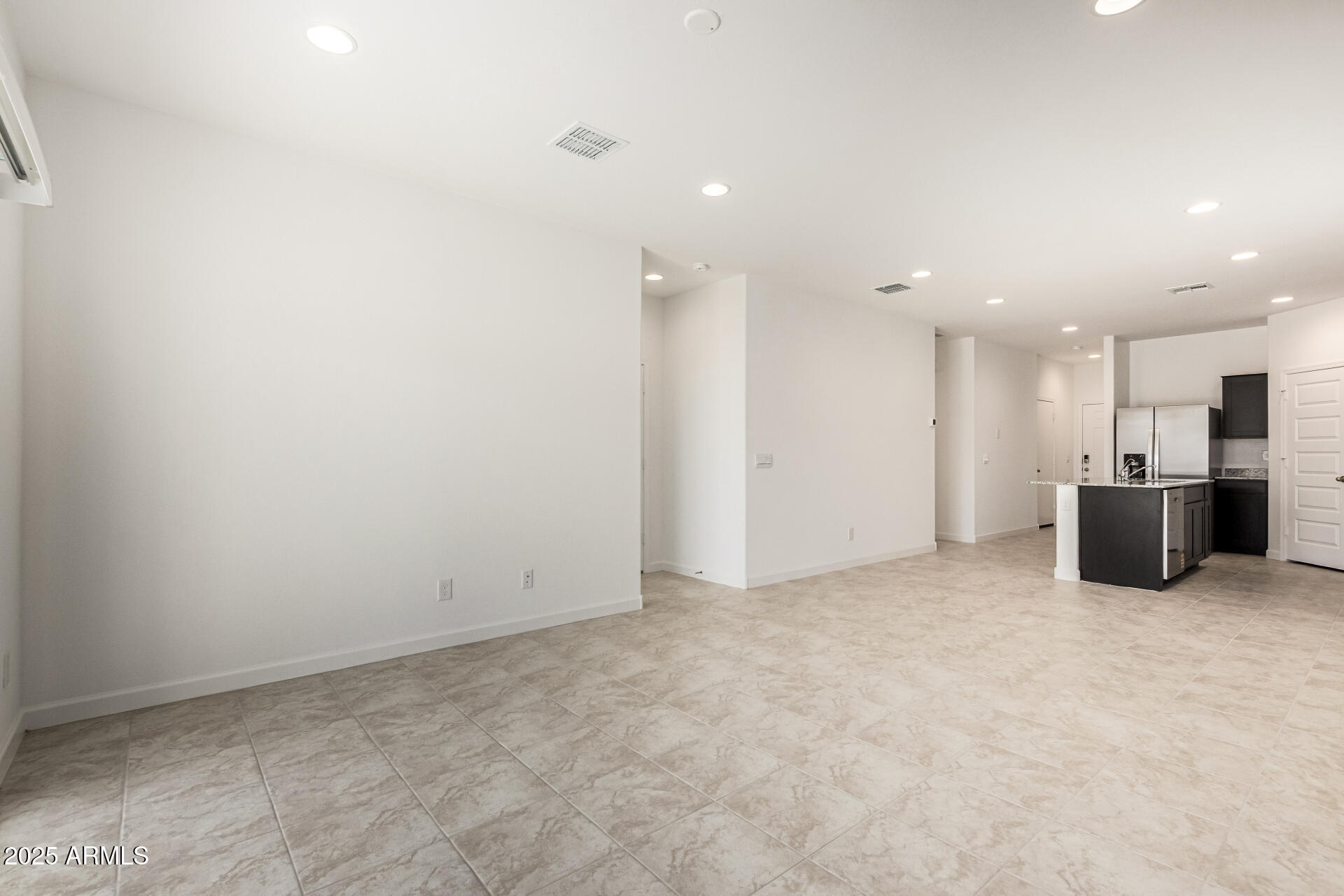 5507 East Mearn Road San Tan Valley, AZ 85140 - Photo 6 of 30 a view of a big room with stainless steel appliances wooden floor and windows