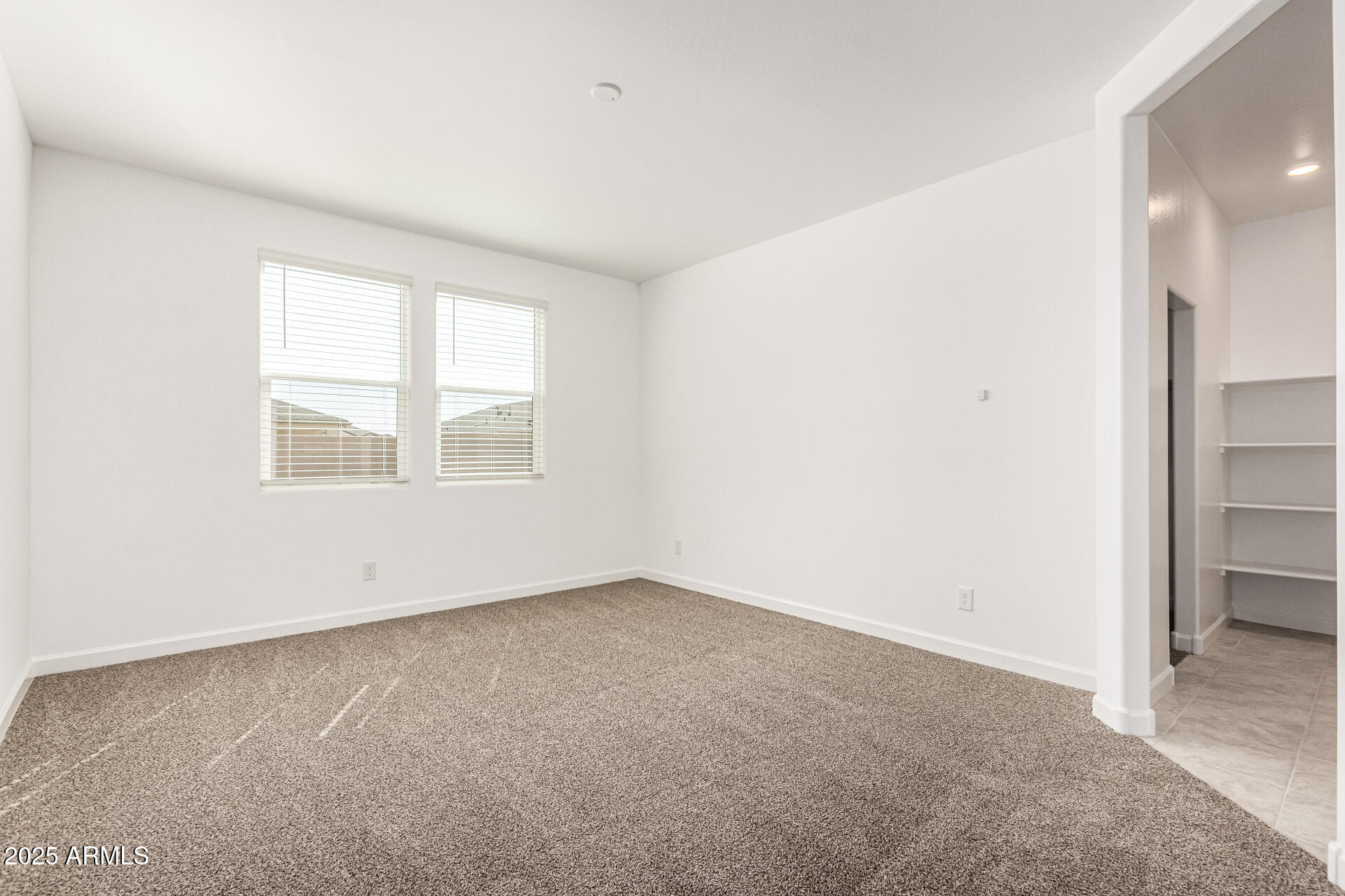 5507 East Mearn Road San Tan Valley, AZ 85140 - Photo 10 of 30 an empty room with a window