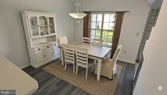 a room with a fireplace and wooden floor
