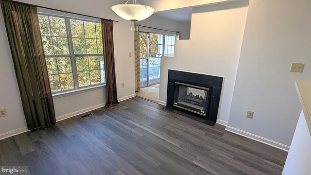 a kitchen with a white stove top oven and cabinets