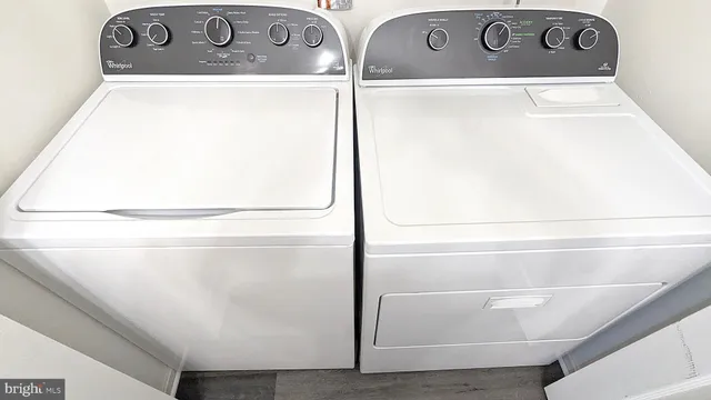 a kitchen with a refrigerator and cabinets