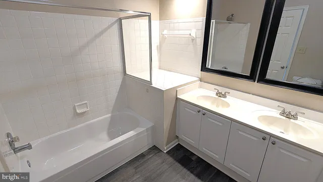 a bathroom with a bathtub and a sink
