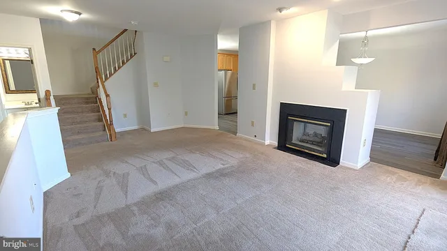 a view of an empty room with stairs