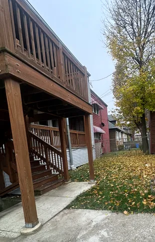 a view of a house with a fence