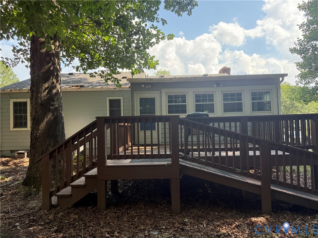 10700 Blossomwood Road Chesterfield, VA 23832 - Photo 5 of 6 Expansive rear deck featuring wood railings, stair