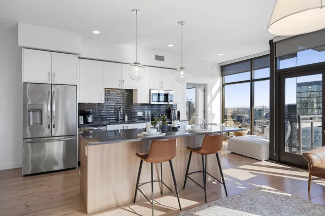 a bedroom with a bed and a painting