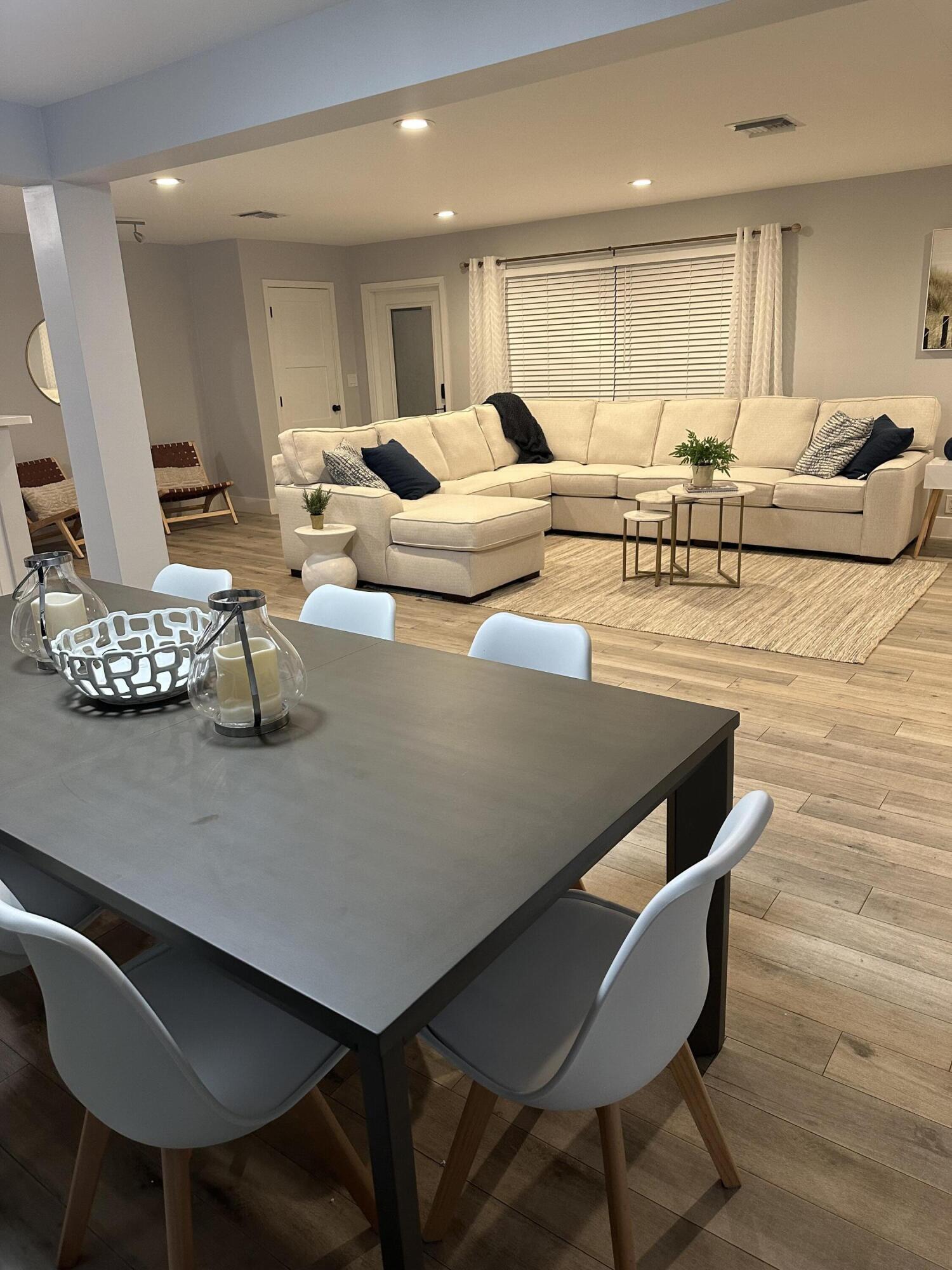 5111 Northeast 27th Terrace Lighthouse Point, FL 33064 - Photo 13 of 23 a living room with furniture wooden floor and a table