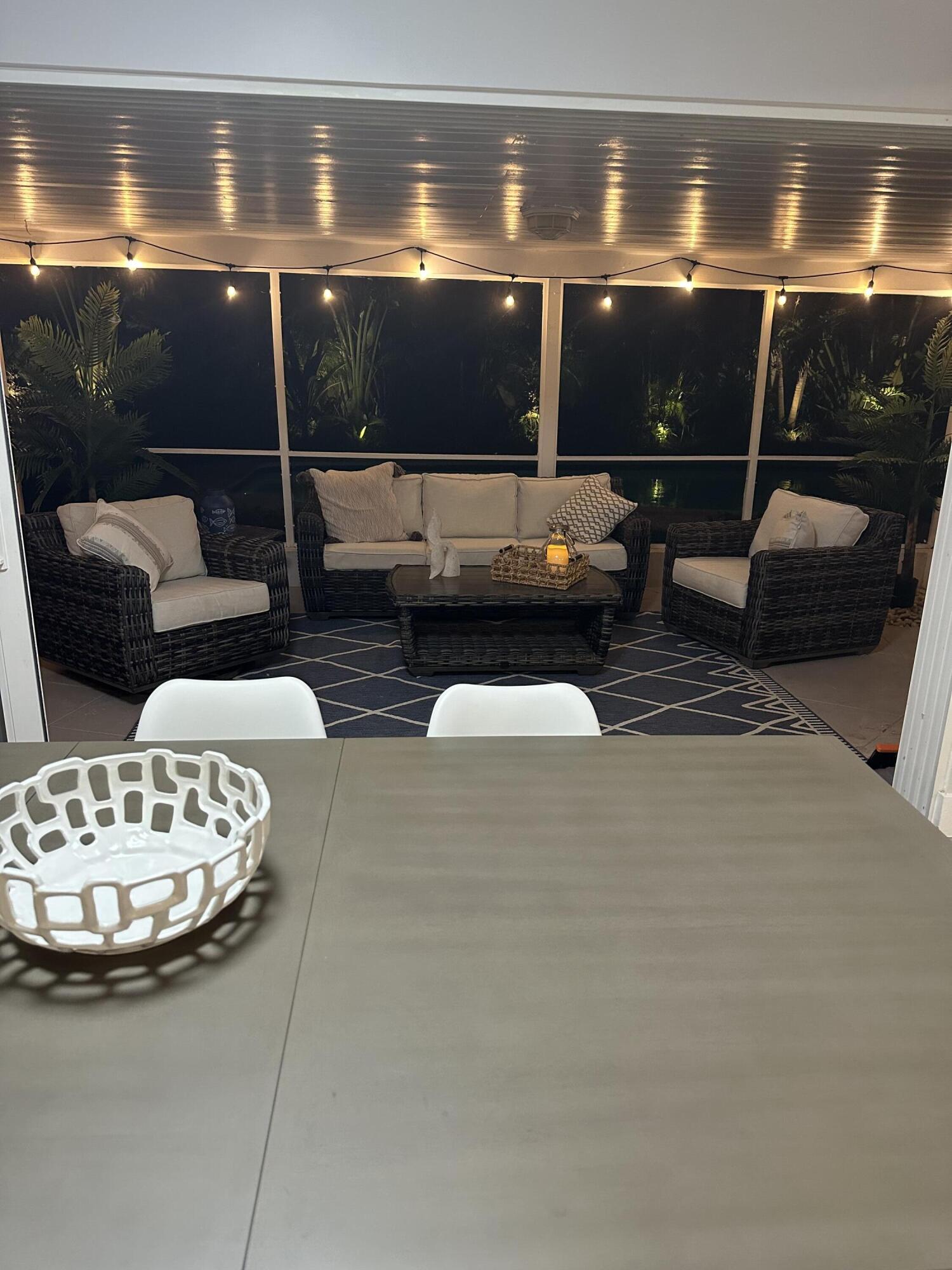 5111 Northeast 27th Terrace Lighthouse Point, FL 33064 - Photo 15 of 23 a living room with furniture and a lamp