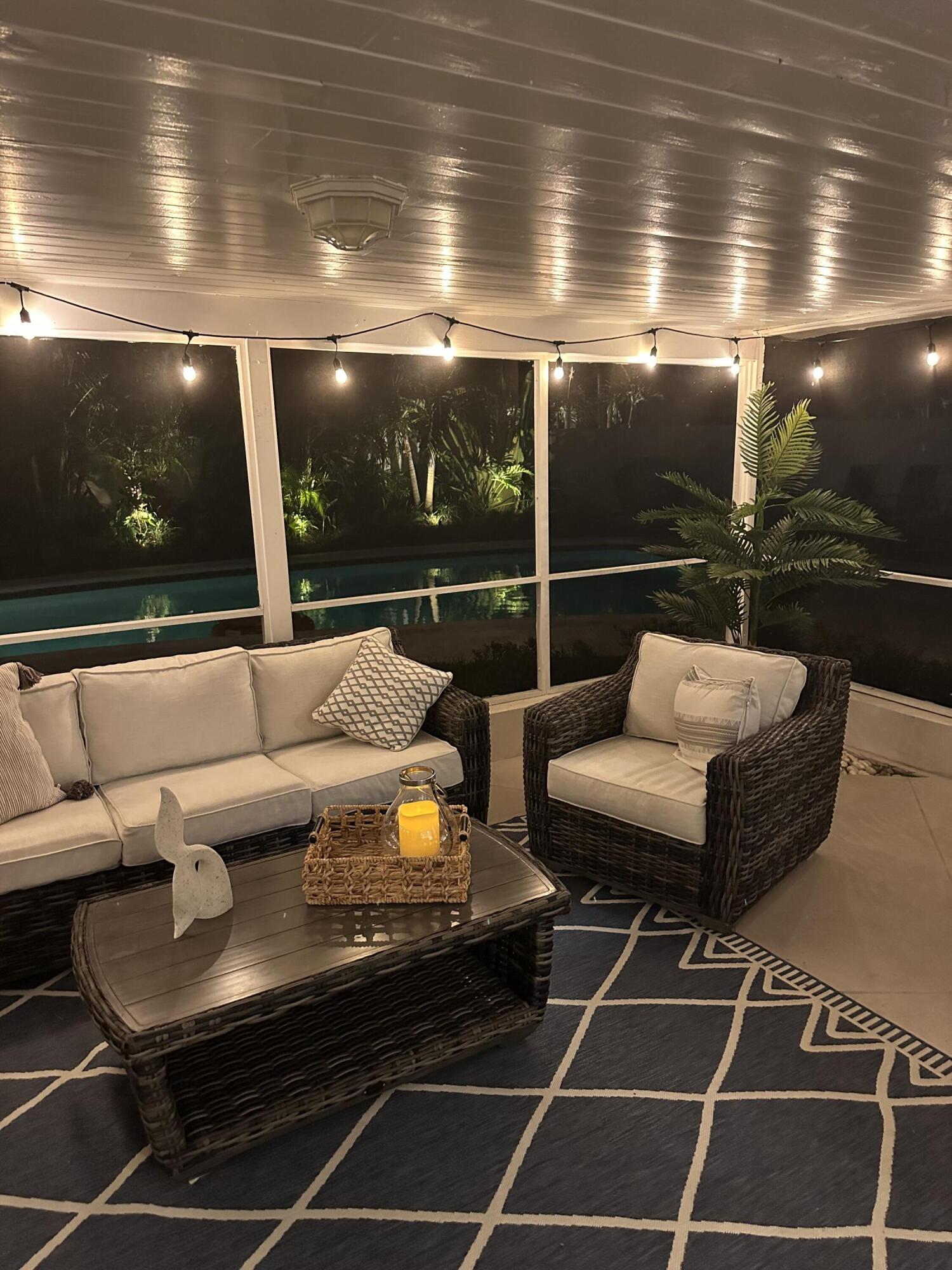 5111 Northeast 27th Terrace Lighthouse Point, FL 33064 - Photo 16 of 23 a outdoor living space with patio furniture and potted plants