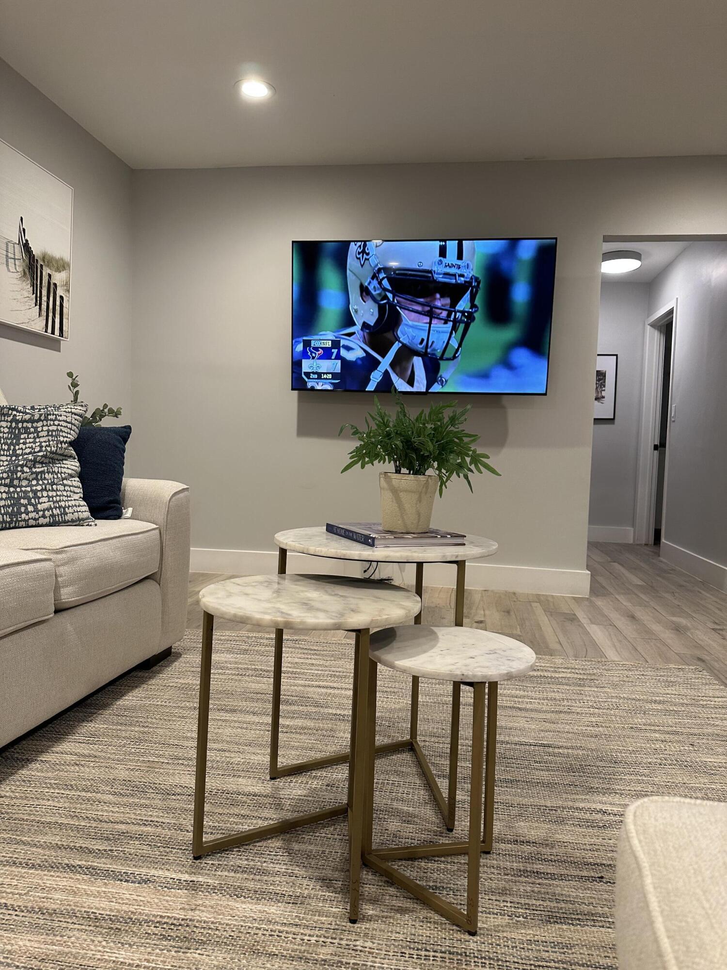 5111 Northeast 27th Terrace Lighthouse Point, FL 33064 - Photo 21 of 23 a living room with furniture and a flat screen tv
