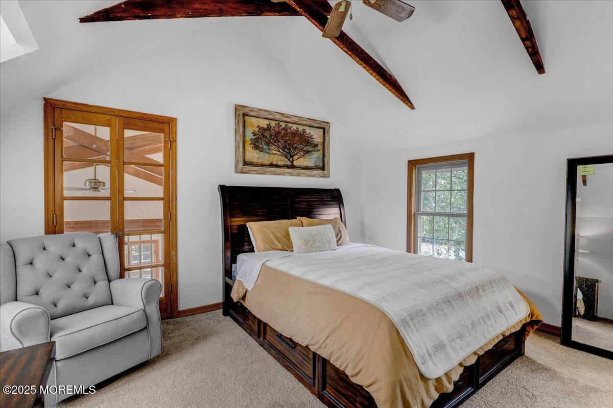 9 Main Street Cream Ridge, NJ 08514 - Photo 20 of 30 a bedroom with a large bed couch and windows