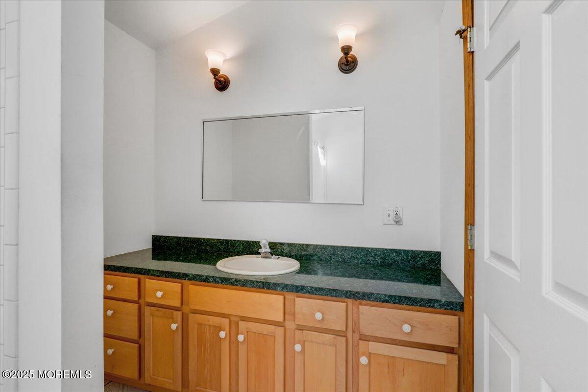 9 Main Street Cream Ridge, NJ 08514 - Photo 25 of 30 a bathroom with a sink and a mirror