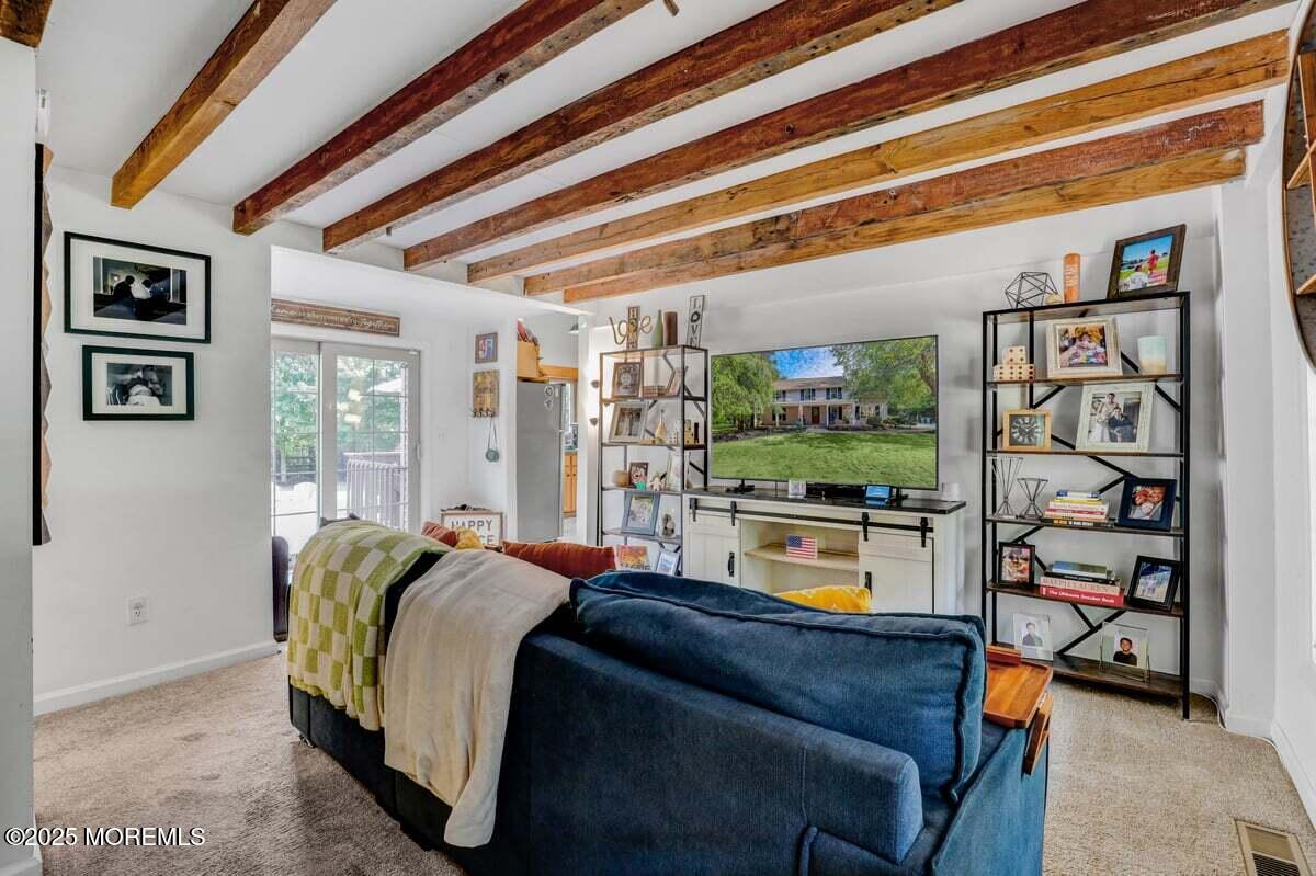 9 Main Street Cream Ridge, NJ 08514 - Photo 6 of 30 a living room with furniture and a flat screen tv