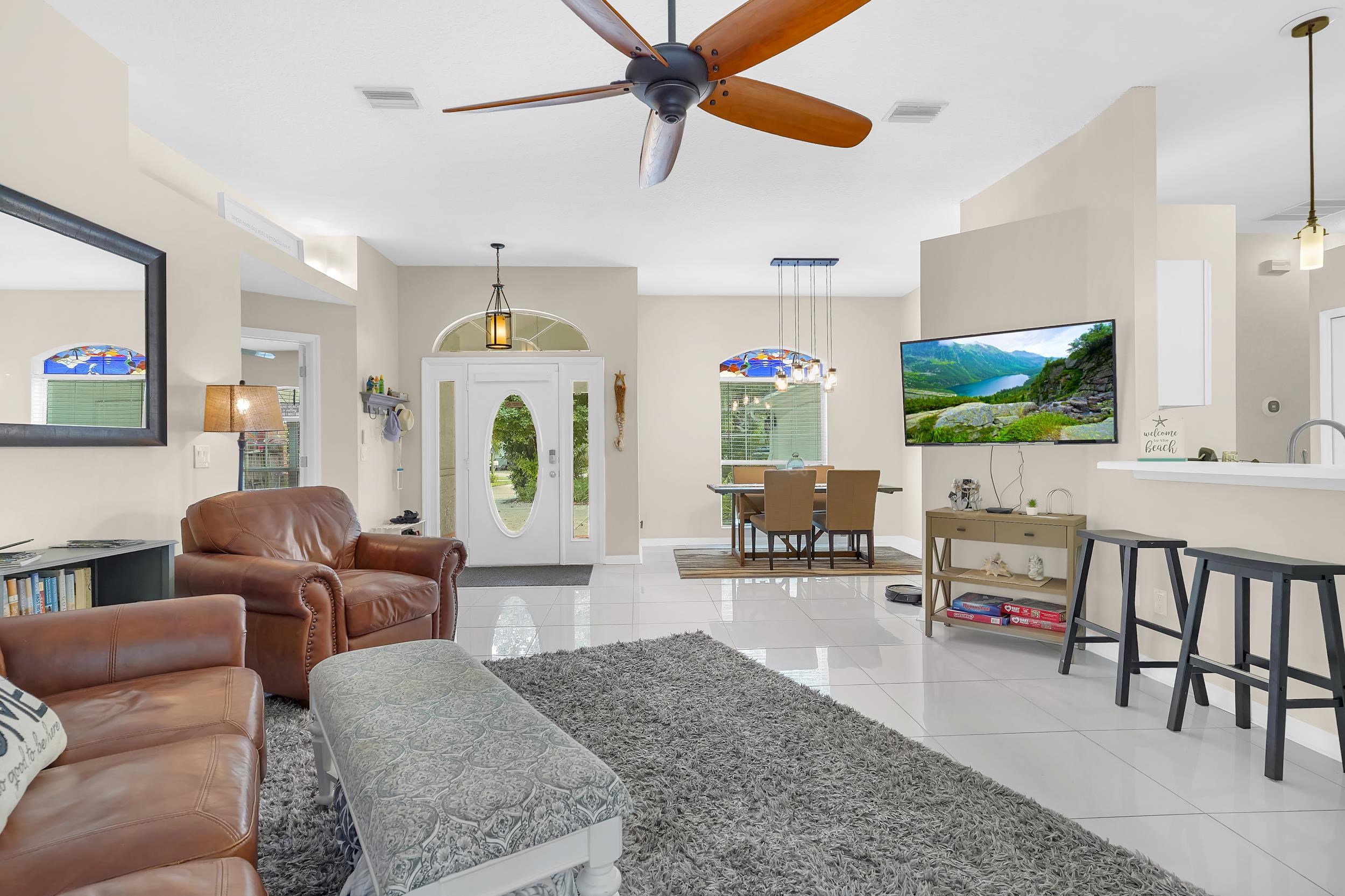 308 A Street St. Augustine, FL 32080 - Photo 15 of 46 a living room with furniture and a flat screen tv
