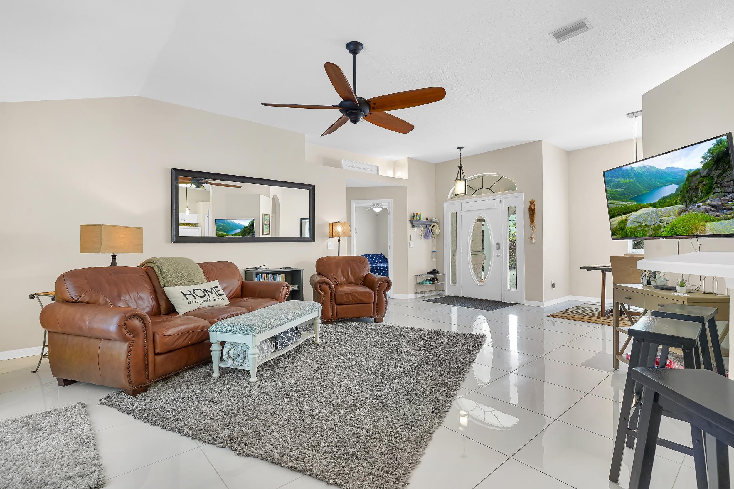 308 A Street St. Augustine, FL 32080 - Photo 16 of 46 a living room with furniture and a flat screen tv