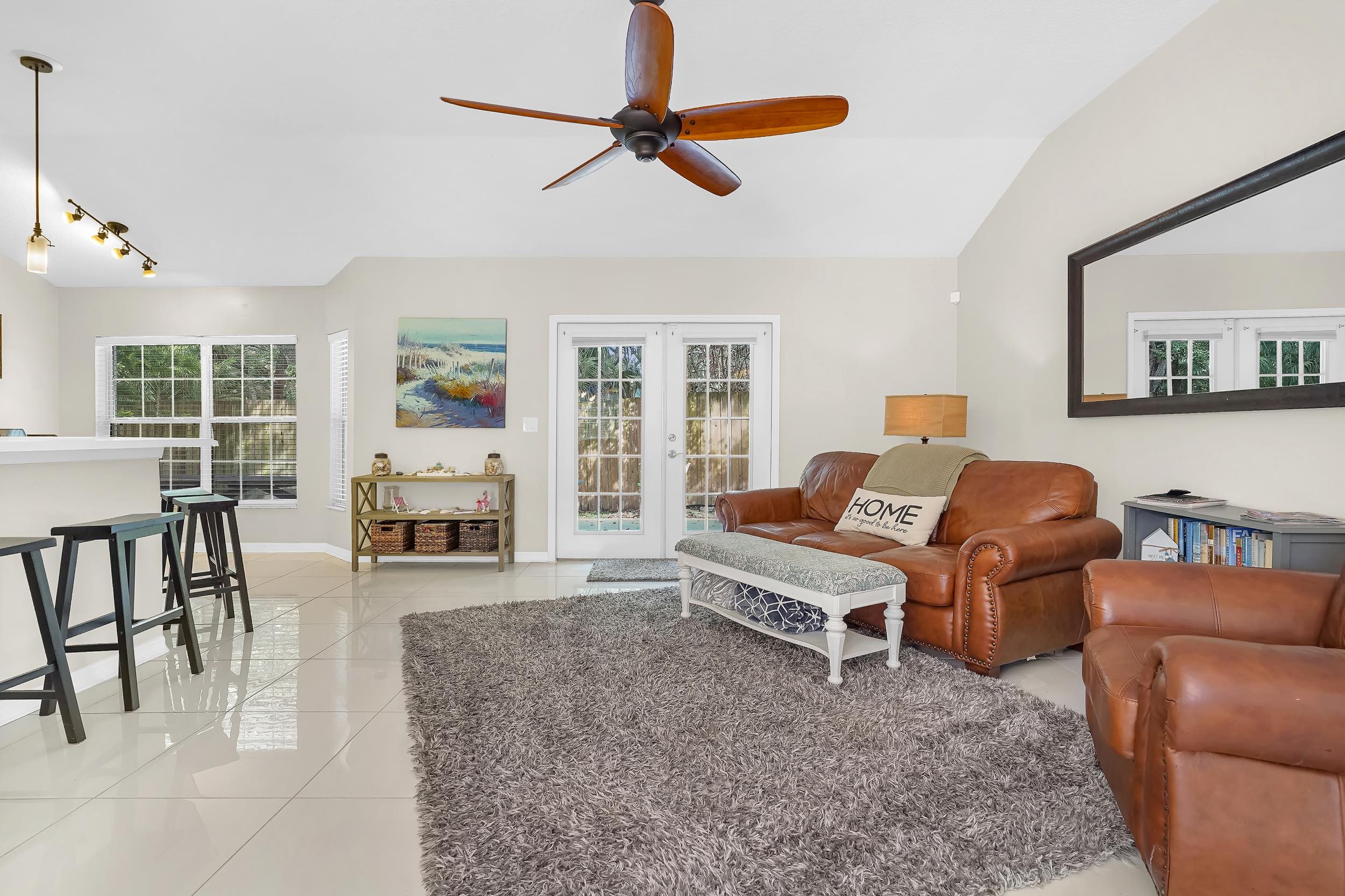 308 A Street St. Augustine, FL 32080 - Photo 19 of 46 a living room with furniture and a flat screen tv