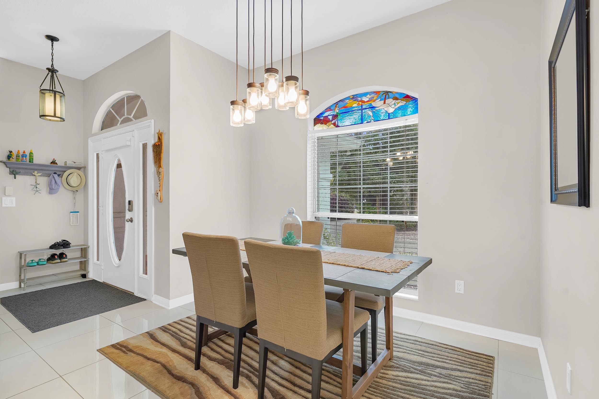 308 A Street St. Augustine, FL 32080 - Photo 20 of 46 a view of a dining room with furniture wooden floor and a chandelier