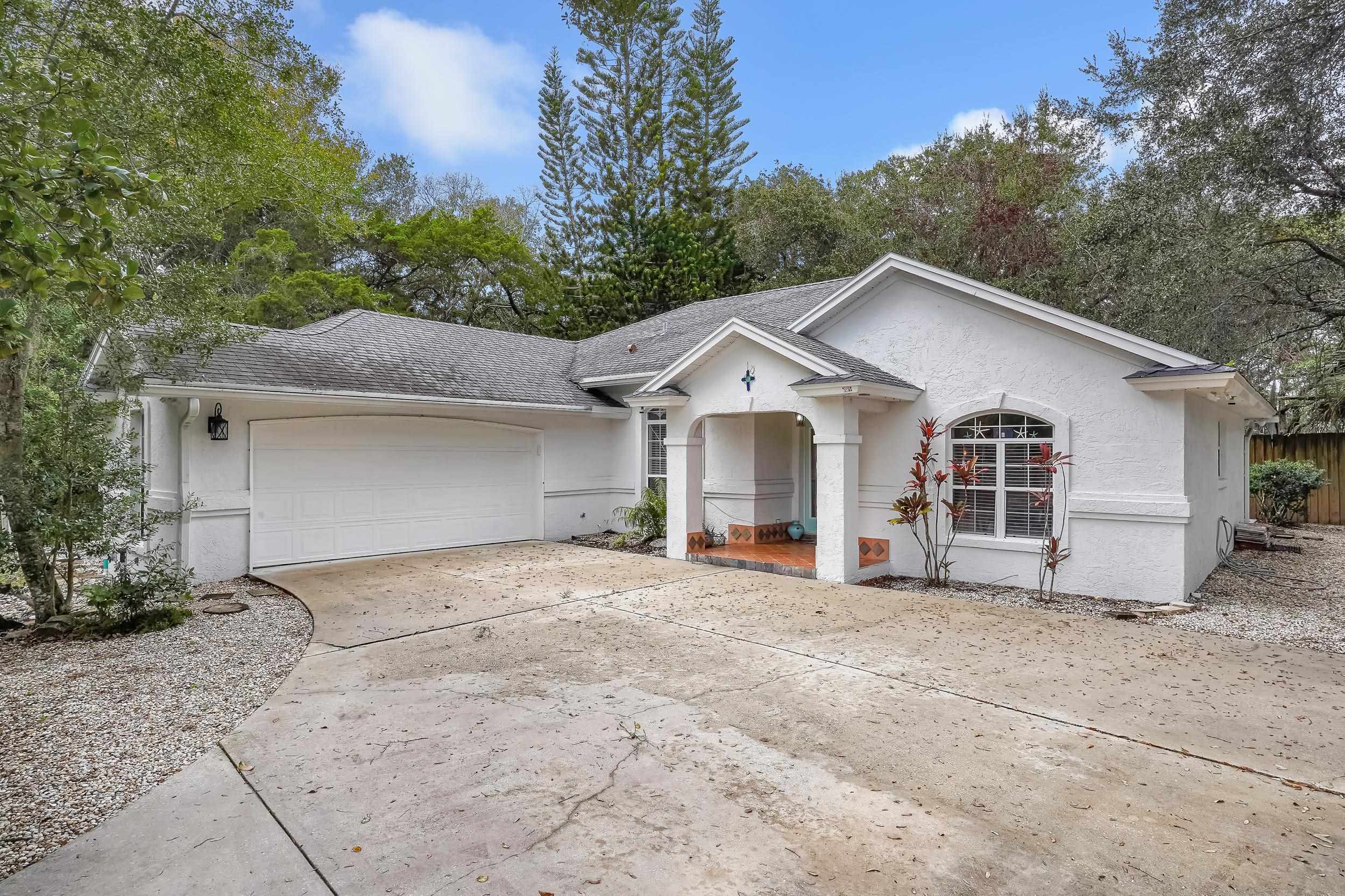 308 A Street St. Augustine, FL 32080 - Photo 2 of 46 a view of a house with a yard and large tree