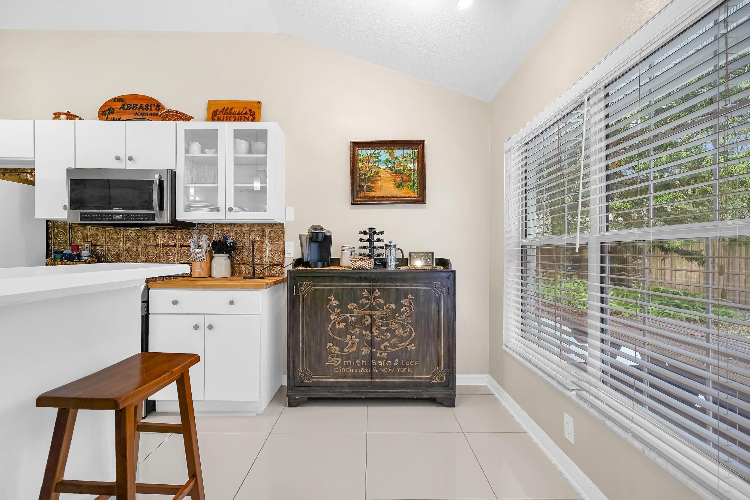 308 A Street St. Augustine, FL 32080 - Photo 23 of 46 a view of a kitchen with furniture and flat screen tv