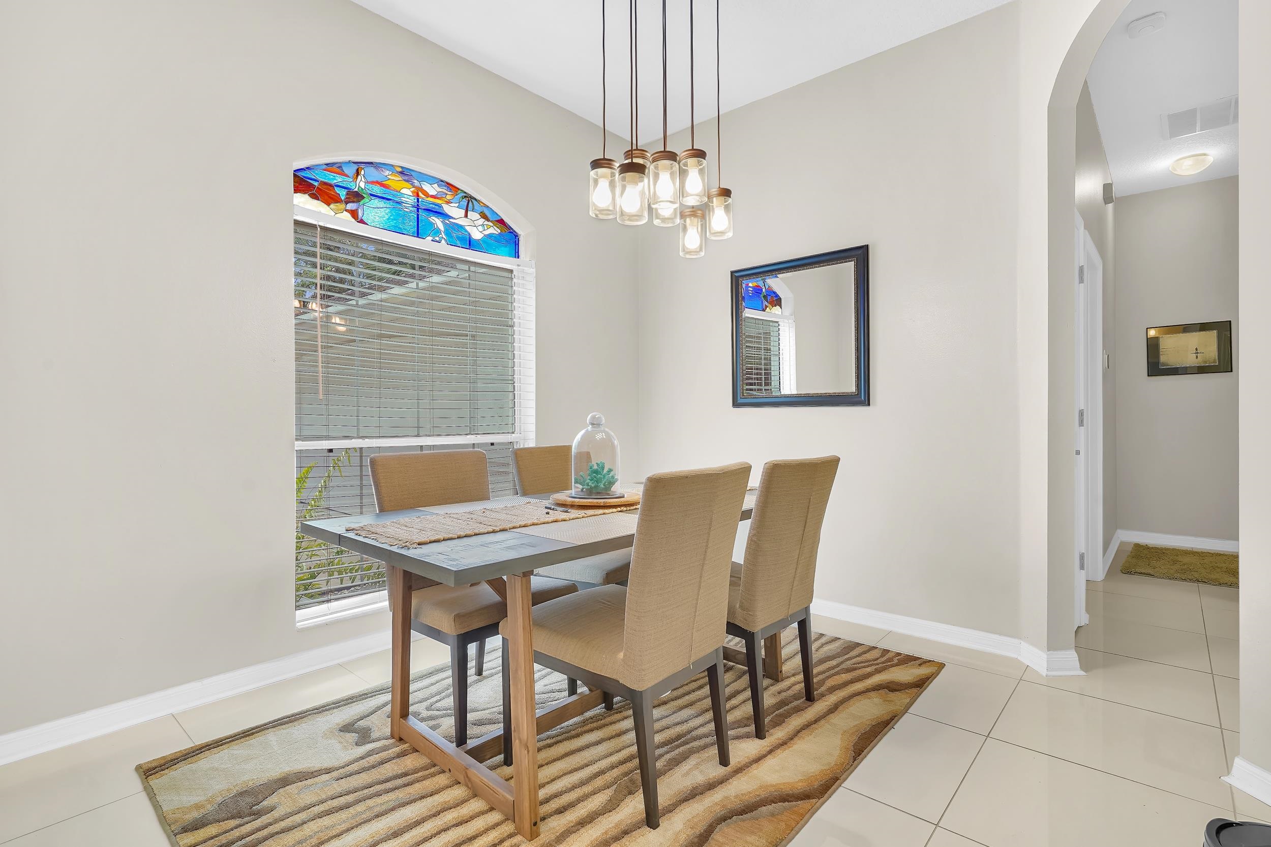 308 A Street St. Augustine, FL 32080 - Photo 26 of 46 a view of a dining room with furniture and a chandelier