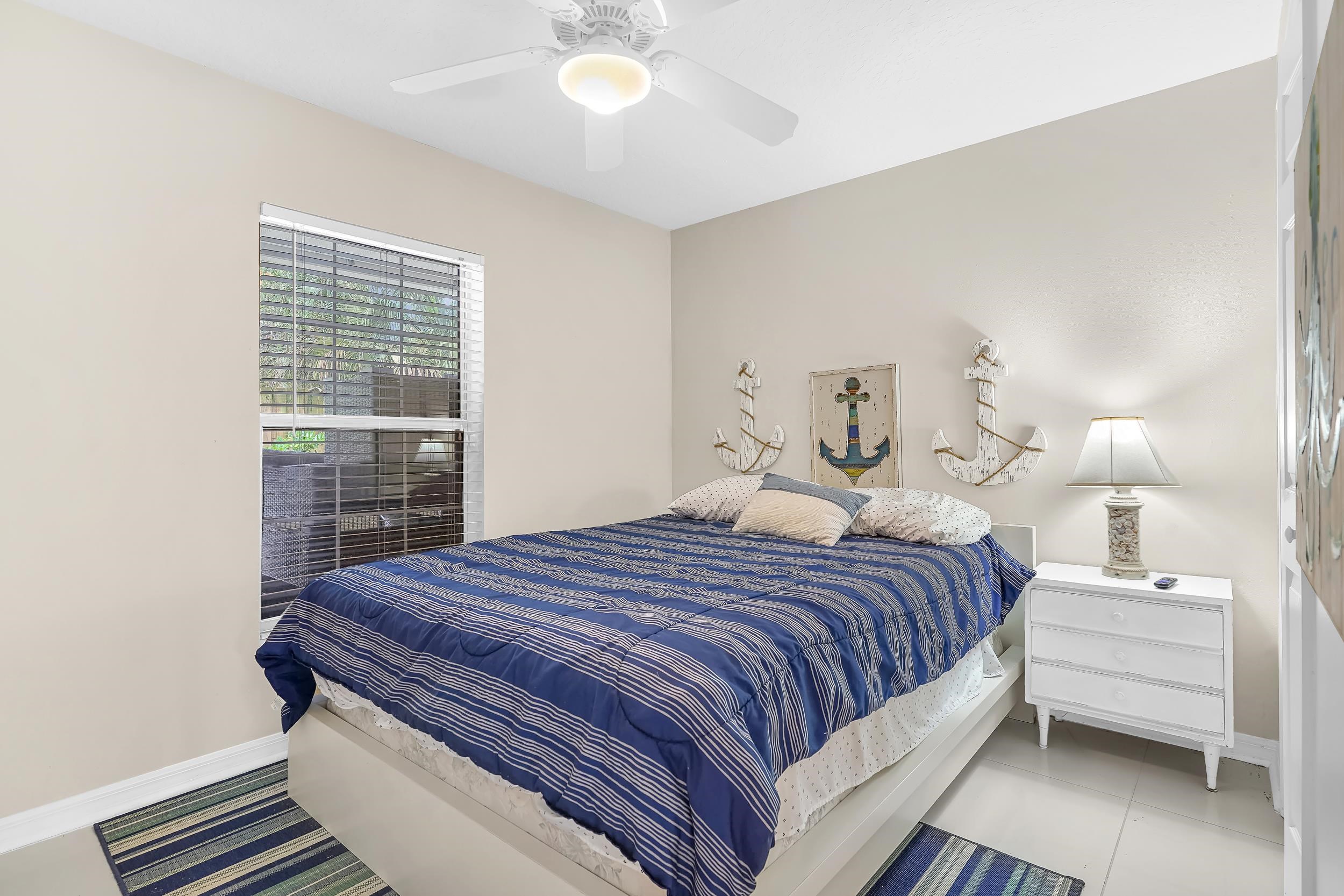 308 A Street St. Augustine, FL 32080 - Photo 34 of 46 a bedroom with a bed and a cabinets