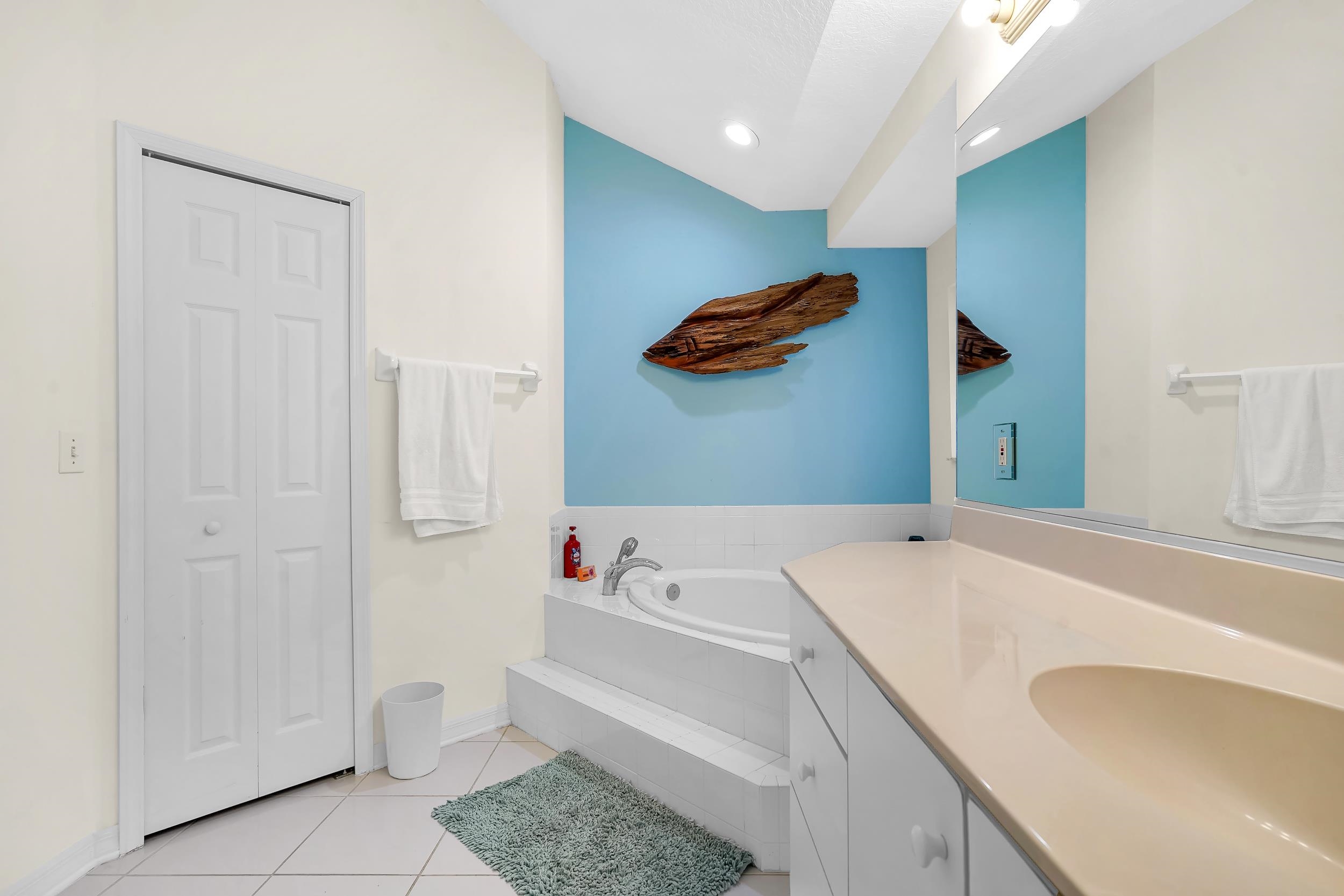 308 A Street St. Augustine, FL 32080 - Photo 37 of 46 a bathroom with a sink and a mirror