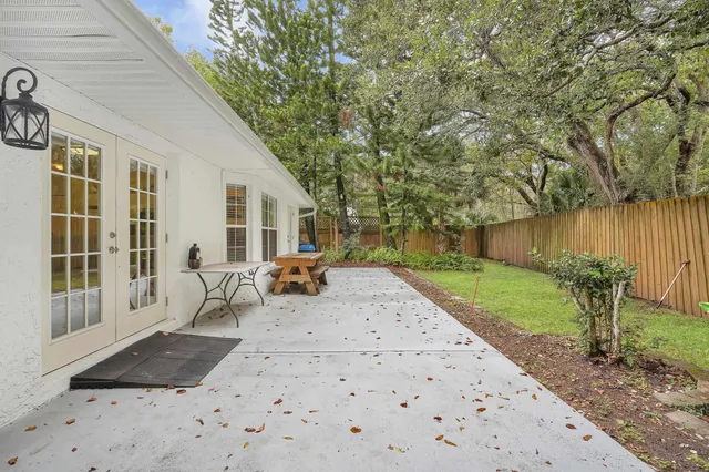 a view of a backyard with sitting area