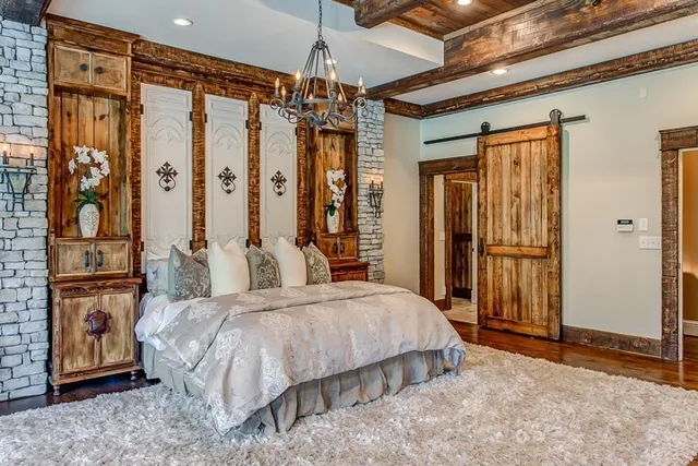 a bedroom with a large bed and a dresser