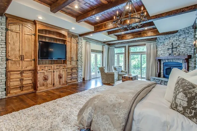 a bed room with a bed and a television