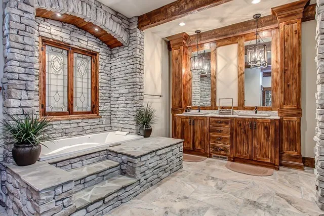 a bathroom with a tub and sink