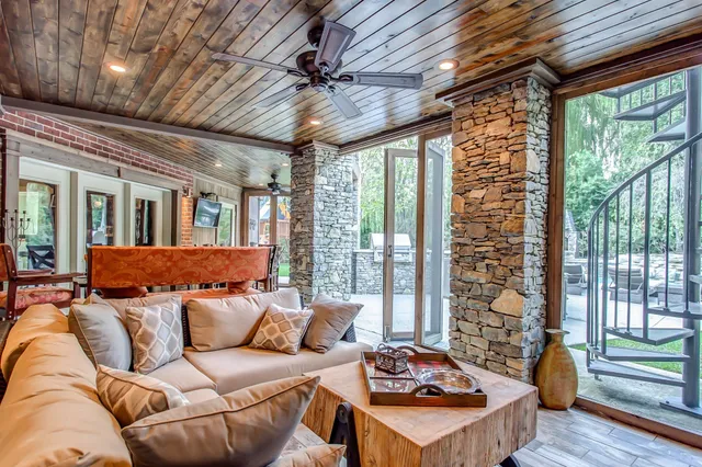 a dining room with furniture window and wooden floor