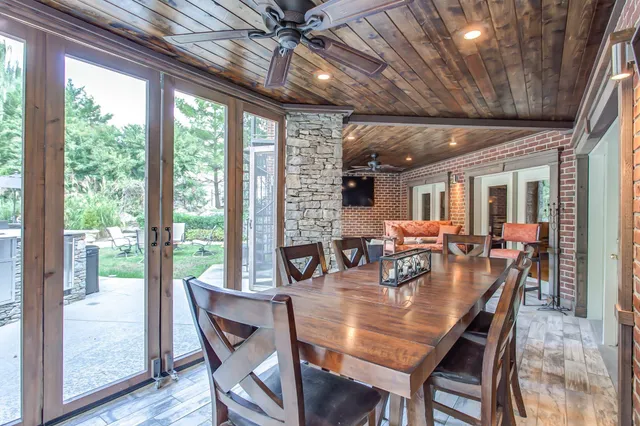 a outdoor living space with furniture and a fireplace