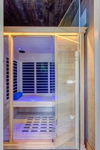 a view of a house with backyard porch and sitting area