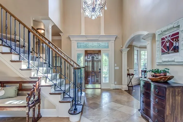 a view of entryway and hall with dining room