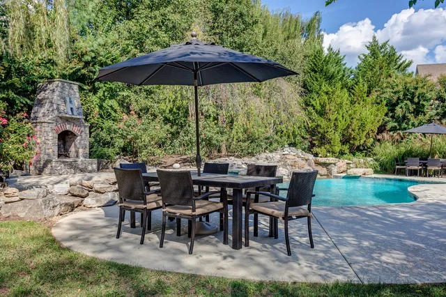 a view of backyard with seating and green space